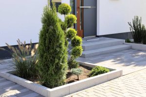 Residential home with modern block paving and front yard