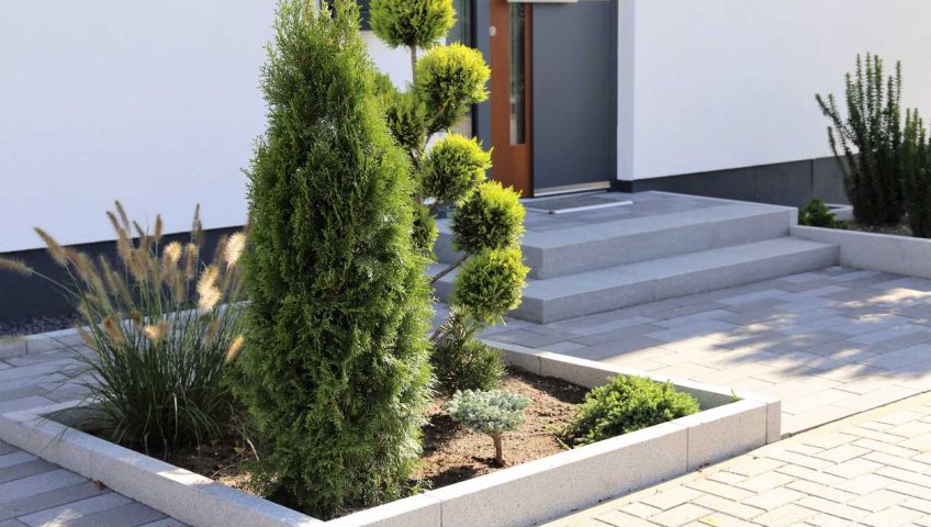 Residential home with modern block paving and front yard