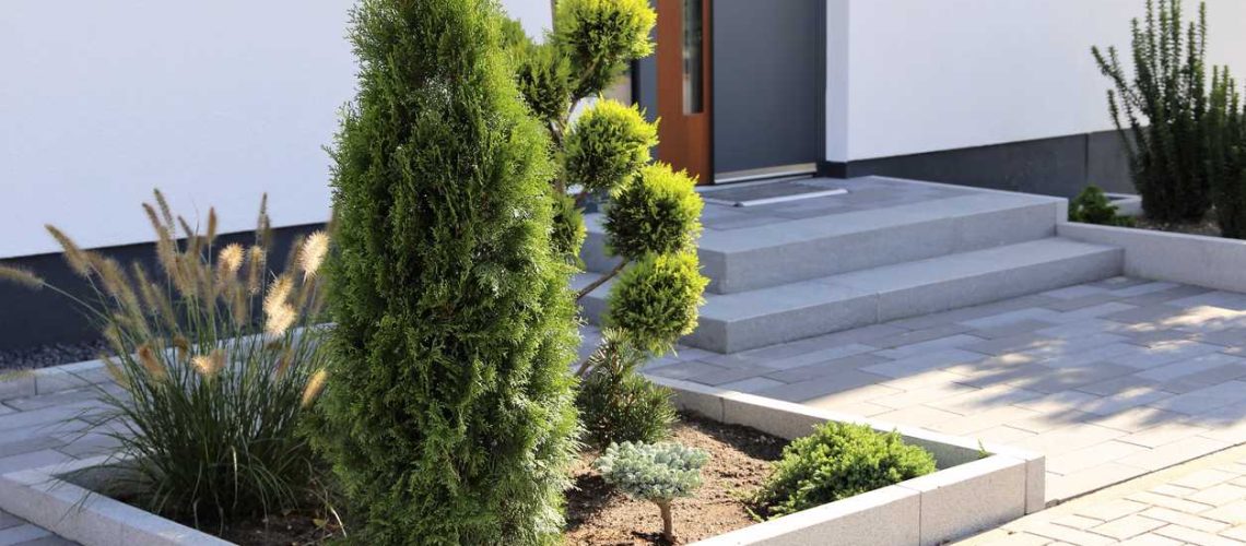 Residential home with modern block paving and front yard